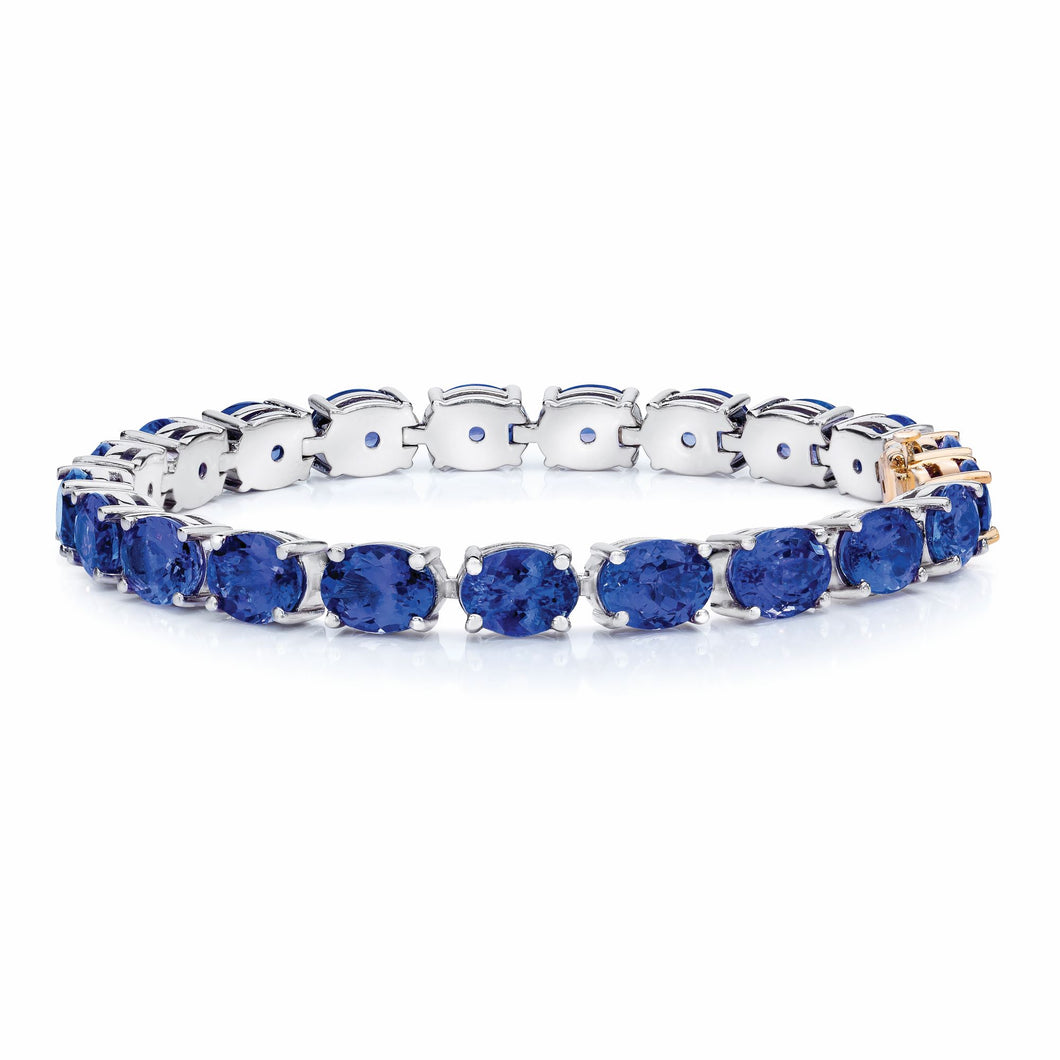 Oval Shaped Tanzanite Bracelet set in 925 Silver with a 14k Yellow Gold Lock