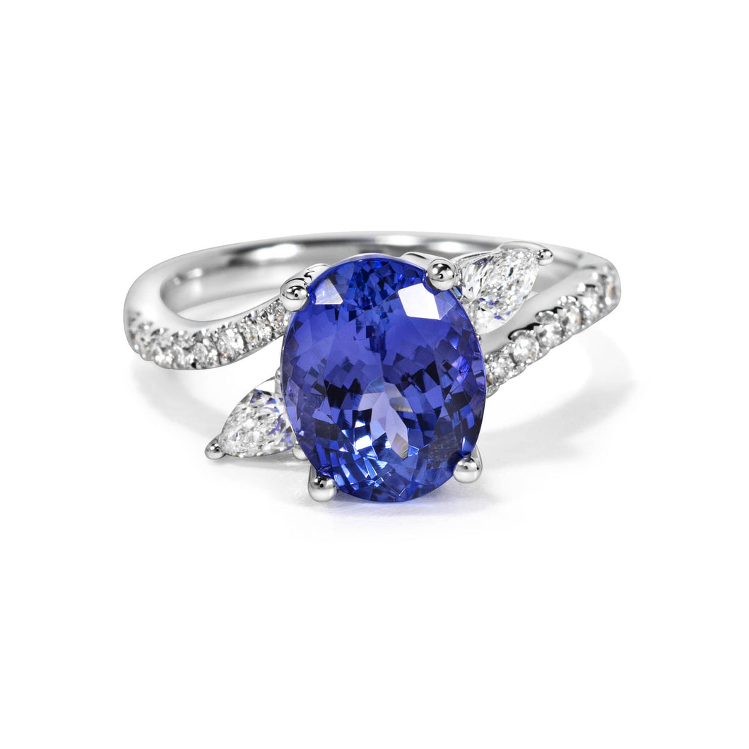 Pear and Round Shaped diamond Ring with Oval Shaped Tanzanite set in 14k White Gold